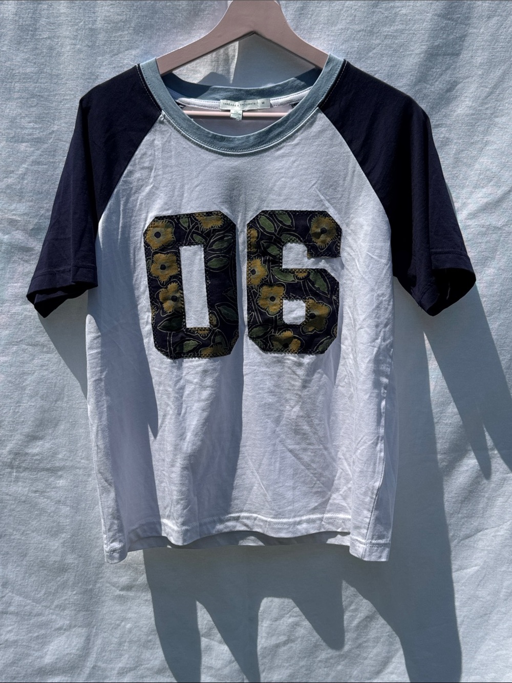Threads 4 Thought White & Navy Raglan Tee with Floral '06' Applique